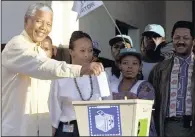  ??  ?? Nelson Mandela casts his vote at the Ohlange High School hall in Inanda, north of Durban, on April 27 1994, the country’s first free general election.