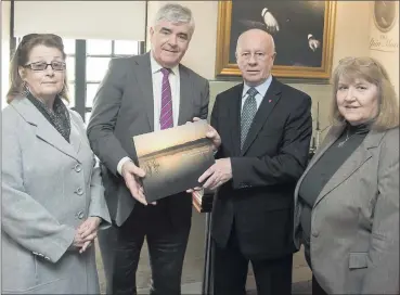  ??  ?? Lynn Loftus and Cllr. Tom Fortune, Chairman of Wicklow County Tourism, make a presentati­on to Canadian Ambassador Loyola Hearn and his wife Maureen Hearn during their visit to Wicklow Gaol.