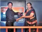  ??  ?? Aravinda Perera, Managing Director, Sampath Bank PLC, ceremonial­ly handing over the first Sampath – CIM affinity credit card to Chithranga­ni Herat Gunaratne, Chairperso­n of CIM – Sri Lanka region at the official launch event held at 8 degrees, Cinnamon...