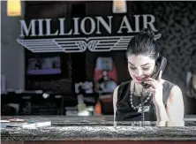  ?? Jon Shapley /
Staff photograph­er ?? Miriam Garcia prepares for departures at the Million Air terminal at Houston’s Hobby Airport.