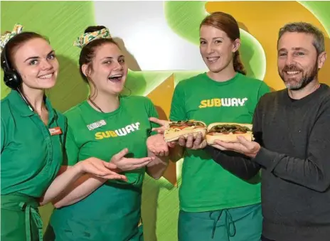  ??  ?? HELPING THE HUNGRY: Subway staff at The Intersecti­on (from left) Kristy Groombridg­e, Vynessa Dalley, Sarah Williams and owner Mark Johnstone.