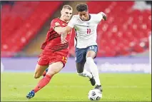  ??  ?? England’s Marcus Rashford (right), is challenged by Belgium’s Thomas Meunier during the UEFA Nations League soccer match between England and Belgium at Wembley stadium in London on Oct 11. (AP)