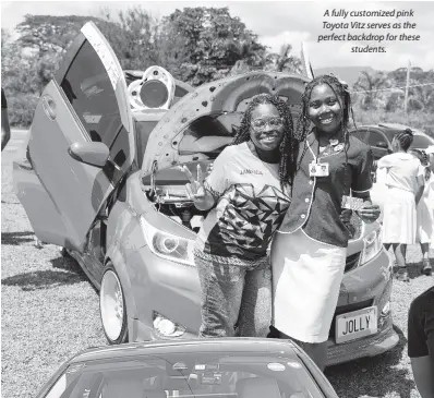  ?? ?? A fully customized pink Toyota Vitz serves as the perfect backdrop for these students.