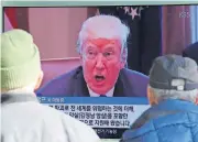  ?? [AP PHOTO] ?? People watch a TV screen showing an image of U.S. President Donald Trump on Tuesday at the Seoul Railway Station in Seoul, South Korea.