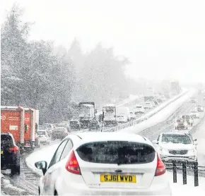  ?? Picture: Wullie Marr ?? There were long tailbacks as cars became stuck on the M90 near the Kelty junction in Fife.