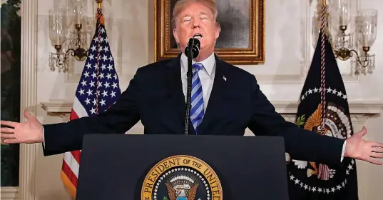  ??  ?? Walking away: Donald Trump in the White House last night announcing that the US is withdrawin­g from the Iran deal