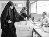  ?? NABIL MOUNZER/EPA ?? A Lebanese Hezbollah supporter casts her vote at a polling place in Beirut, where turnout was 30 to 40 percent.