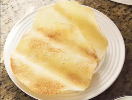  ?? ?? Cassava bread, toasted and brushed with melted butter (Photo by Cynthia Nelson)