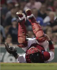  ?? CHARLES KRUPA - THE ASSOCIATED PRESS ?? Boston Red Sox catcher Christian Vazquez grabs his knee as he rolls on his back after getting hit with a pitch during the ninth inning of the team’s baseball game against the Tampa Bay Rays at Fenway Park in Boston, Wednesday, July 31, 2019. After an injury delay, Vazquez stayed in the game.