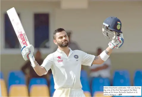  ?? — AFP ?? India’s Virat Kohli celebrates 100 runs during day one of the first Test against the West Indies at Sir Vivian Richards Stadium in St John’s, Antigua.