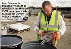  ??  ?? Alan Ennis sorts through syringes to be recycled at the EPA/ ENVA hazardous waste collection in Carnew Mart, Co Wicklow