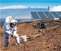  ?? PHOTO: UNIVERSITY OF HAWAII ?? A scientist collects soil samples from a Hawaiian volcano while spending a year simulating life on Mars.