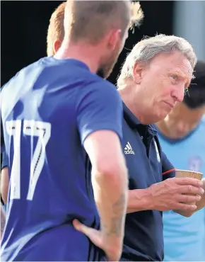  ??  ?? > Neil Warnock and Kenneth Zohore chatting during the Tavistock friendly