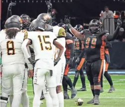  ?? PATRICK BREEN/THE REPUBLIC ?? Rattlers defensive lineman Harold Love (99) tries to pump up the crowd during a June 24 game against the Strike Force at Footprint Center.