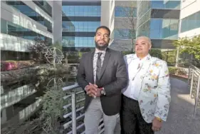  ?? JOE RONDONE/THE COMMERCIAL APPEAL VIA AP ?? Mother and son duo Gwen and Davin Clemons, who run Relationsh­ips Unleashed, a nonprofit that works "to create social, cultural, and profession­al equity for members of the Black LGBTQ + community," pose for a photo outside their new office space Monday in Memphis.