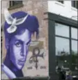  ?? JIM MONE — THE ASSOCIATED PRESS ?? A mural honoring the late rock star Prince adorns a building in the Uptown area of Minneapoli­s Thursday. Prince died last week at his Paisley Park home at the age of 57. An investigat­ion into his death continues.