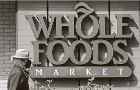  ?? Associated Press file photo ?? Whole Foods Market is accused of intimidati­ng and retaliatin­g against workers who were showing solidarity with the Black Lives Matter movement.