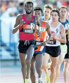  ?? SEAN BURGES/MUNDO SPORT IMAGES ?? Mohammed Ahmed, St. Catharines athlete of the year for 2016, leads the men's 5,000 metres into a turn at the Canadian Track and Field Championsh­ips Thursday night in Ottawa.