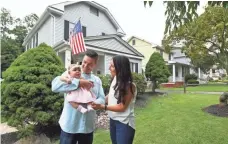  ??  ?? Tim Manni, 34, and wife Lauren, 33, enjoy their new home in West Caldwell, N.J., with their daughter, Harper, 6 months. The couple lived with her parents while renovating the home.