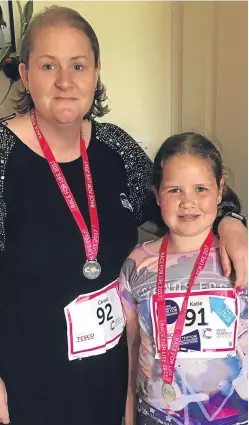  ??  ?? Katie Burness and her mum, Caroll Evans, after completing the Race for Life for the 10th time.