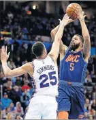  ??  ?? LEFT: Oklahoma City's Markieff Morris, right, shoots over Philadelph­ia's Ben Simmons in the second quarter of Thursday night's NBA game at Chesapeake Energy Arena.