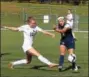  ?? AUSTIN HERTZOG — DFM ?? In this file photo, Conestoga’s Caitlyn Ellerbeck (12) clears the ball away from SpringFord’s Mack Mitchell during their District 1-AAAA girls soccer quarterfin­al. Mitchell scored the game-deciding goal in the Rams’ win over Neshaminy.