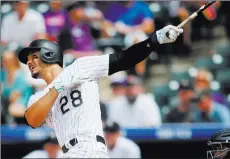  ?? Chris Humphreys ?? USA Today Nolan Arenado follows through on the first of his three home runs Wednesday in the Rockies’ 18-4 win over the Padres at Coors Field. The All-star third baseman finished 5-for-6 with seven RBIS and four runs.