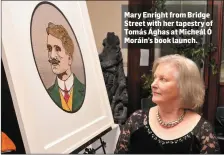  ??  ?? Mary Enright from Bridge Street with her tapestry of Tomás Ághas at Micheál Ó Moráin’s book launch.