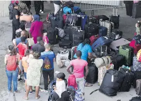  ?? — THE CANADIAN PRESS FILES ?? Asylum seekers crossing into Canada illegally have created a backlog in the immigratio­n system.