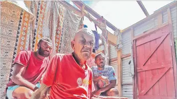  ?? Picture: JOVESA NAISUA ?? Right: Ulaiasi Koroi Gavidi (middle) with the two men who helped keep him safe at the height of STC Yasa that ravaged Galoa Island last week.