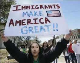  ?? LM OTERO, THE ASSOCIATED PRESS ?? Kathia Suarez protests with others in downtown Sherman, Texas, Thursday. Immigrants across the country stayed home from school and work to show how critical they are to the economy.