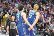  ?? DAVID ZALUBOWSKI AP ?? Creighton’s Ryan Nembhard (left) celebrates with Trey Alexander near the end of Sunday’s win.