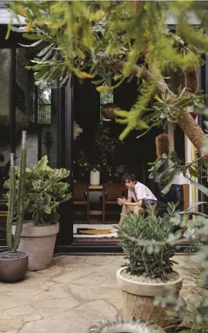  ??  ?? Singer-songwriter Troye Sivan in his Melbourne home designed by Flack Studio (page 88).