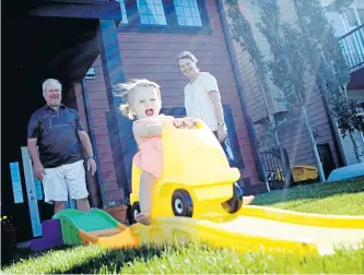  ?? RACHEL BOEKEL PHOTOGRAPH­Y ?? The Van Zyl’s enjoy time with their granddaugh­ter in Brooks, Alberta.