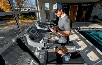  ?? PHOTO: ALDEN WILLIAMS/FAIRFAX NZ ?? Blair Williamson training for the Christchur­ch Marathon, with his trusty Rubik’s Cube.