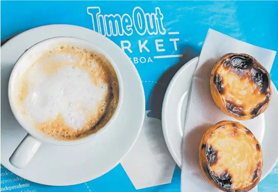  ?? DEBRA BRUNO/THE WASHINGTON POST ?? Pasteis de nata are the only food item offered at the Manteigari­a cafe in the Time Out Market at the Mercado da Ribeira near the Lisbon waterfront.