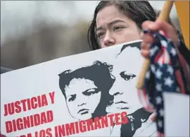  ?? Andrew Caballero-Reynolds AFP/Getty Images ?? A GIRL joins a rally this month to support extending temporary protected status for 262,000 Salvadoran­s. The Trump administra­tion ended the program.