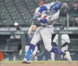  ?? TED S. WARREN — THE ASSOCIATED PRESS ?? The Dodgers’ Zach McKinstry hits an RBI single to score Justin Turner during the sixth inning against the Mariners on Monday night at Seattle.