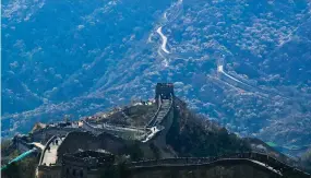  ?? AP ?? Visitors walk on a stretch of the Great Wall of China after it reopened.