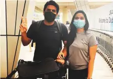  ?? Clint Egbert/Gulf News ?? ■ Sandhu Santhosh and wife Dakshina arrive at Terminal 3 on an Emirates flight from Thiruvanan­thapuram yesterday.