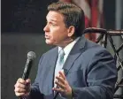  ?? STEPHEN M. DOWELL/ORLANDO SENTINEL ?? Conservati­ve activists are showing up at annual meetings to warn company leaders against engaging in the kind of LGBTQ advocacy that prompted Florida Gov. Ron DeSantis to dismantle Walt Disney’s special tax district.