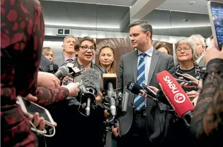  ?? PHOTO: ROBERT KITCHIN/STUFF ?? Green Party leaders Metiria Turei and James Shaw emerge from their weekly caucus yesterday to discuss the expulsion of two dissenting members.