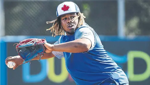  ?? NATHAN DENETTE THE CANADIAN PRESS ?? Blue Jays infielder Vladimir Guerrero Jr. may be used to the limelight, but he is also a teenager navigating his first major-league spring training invite.