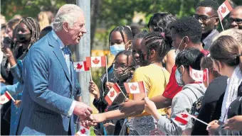  ?? SEAN KILPATRICK THE CANADIAN PRESS ?? Prince Charles visits Assumption Catholic School in Ottawa on Wednesday. Barely 10 per cent of us would strongly support Prince Charles as king and Canada’s official head of state, Bob Hepburn writes.