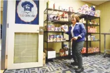  ?? STAFF PHOTO BY TIM BARBER ?? Sandy Rutter, dean of student engagement and support services, stands inside the Tiger Cupboard following Tuesday’s opening of the food pantry room for Chattanoog­a State Community College students in need of help.