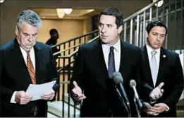  ?? MARK WILSON/GETTY ?? Rep. Devin Nunes, center, announces the investigat­ion’s launch Tuesday in Washington.