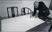  ?? PHOTOS PROVIDED TO CHINA DAILY ?? Artist Michel Comte works on his monochrome painting Salt and Dust