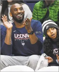  ?? Jessica Hill / Associated Press ?? Kobe Bryant and his daughter Gianna watch the first half between Connecticu­t and Houston on Saturday in Storrs.