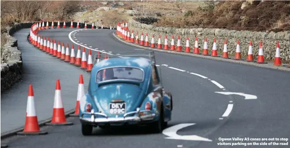  ??  ?? > Ogwen Valley A5 cones are out to stop visitors parking on the side of the road