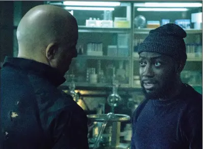  ??  ?? Ray Garrison (Vin Diesel) consults with tech wizard Wilfred Wigans (Lamorne Morris) in Bloodshot.